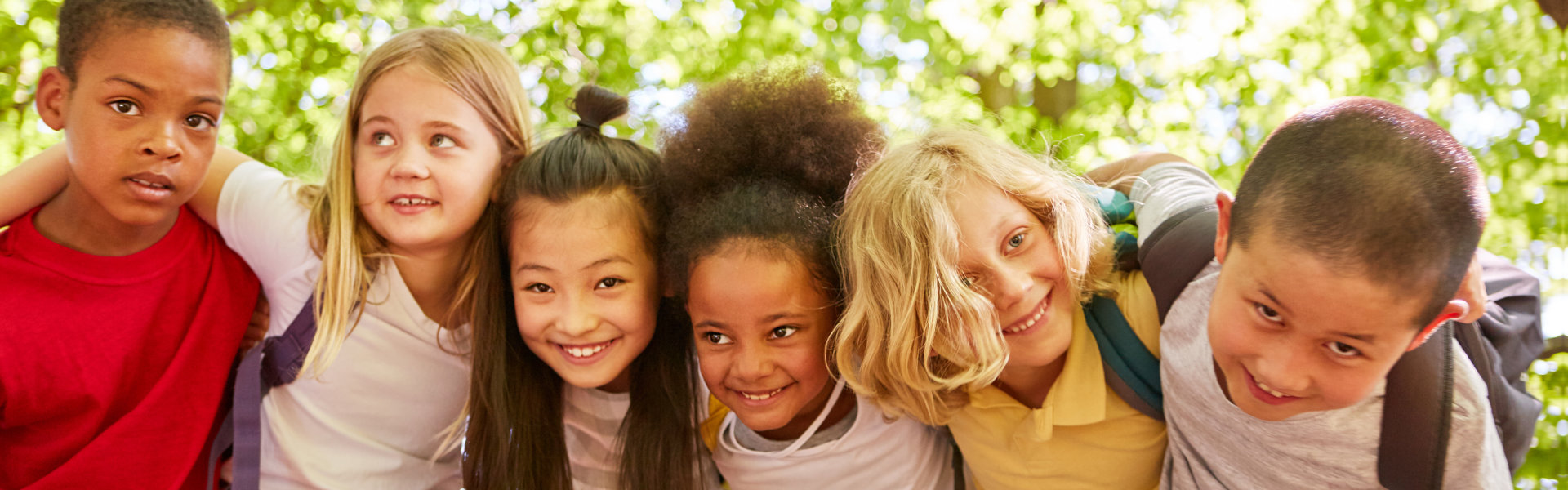 a group of children hugging