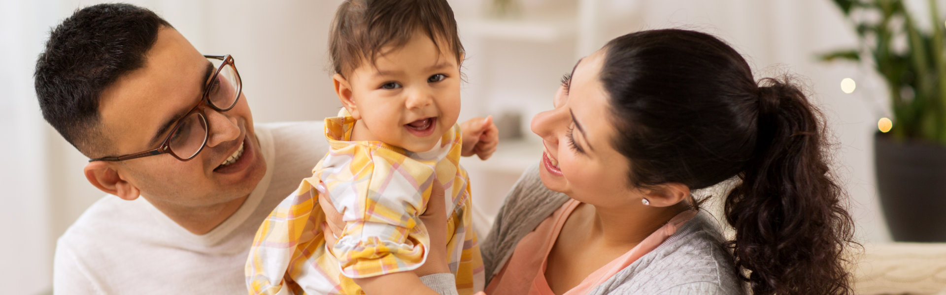 father with baby daughter at home